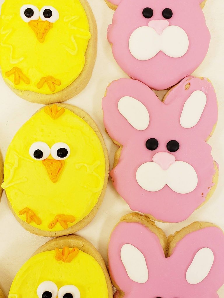 Pink bunny and yellow chick cookies with decorated faces